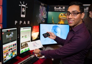 iExpo 2014. Ali Miah, MD of Painting Pixels demonstrates augmented reality on a smartphone